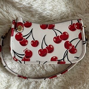 Coach swinger 20 with cherry print